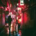 Ilustrācija: japan, osaka, night, asia, landmark, travel, japanese, nature, architecture, city, building, tourist, outdoor, street food, street markets, neon, glow, advertising, urban, man, guy, people, traveller, adventure, rain, umbrella